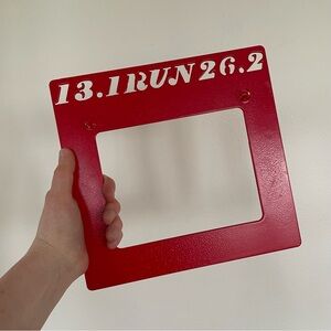 Red metal bib/penant holder for half an full marathons 13.1 and 26.2